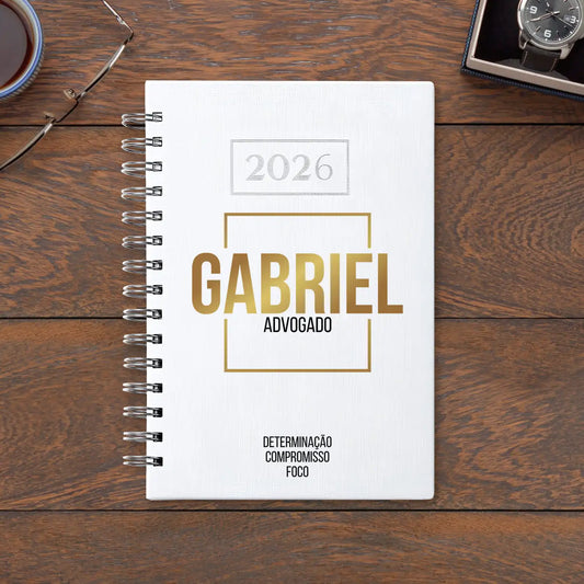 Agenda diária 2026 de argolas personalizada com nome e profissão. Capa PU acolchoado, formato A5.